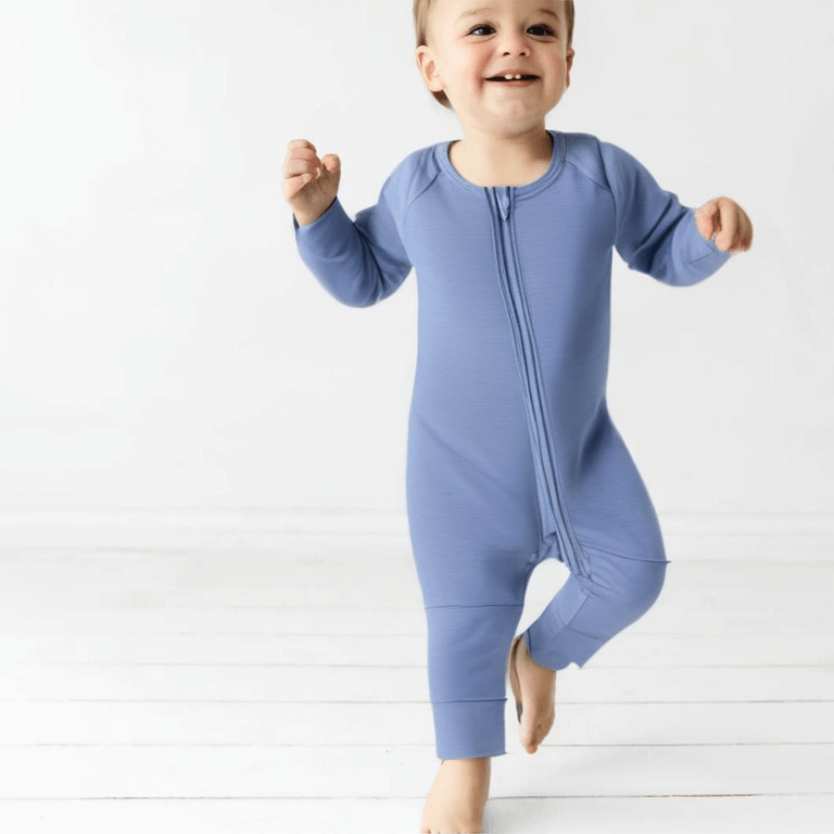 boy toddler wearing blue bamboo pyjama standing up