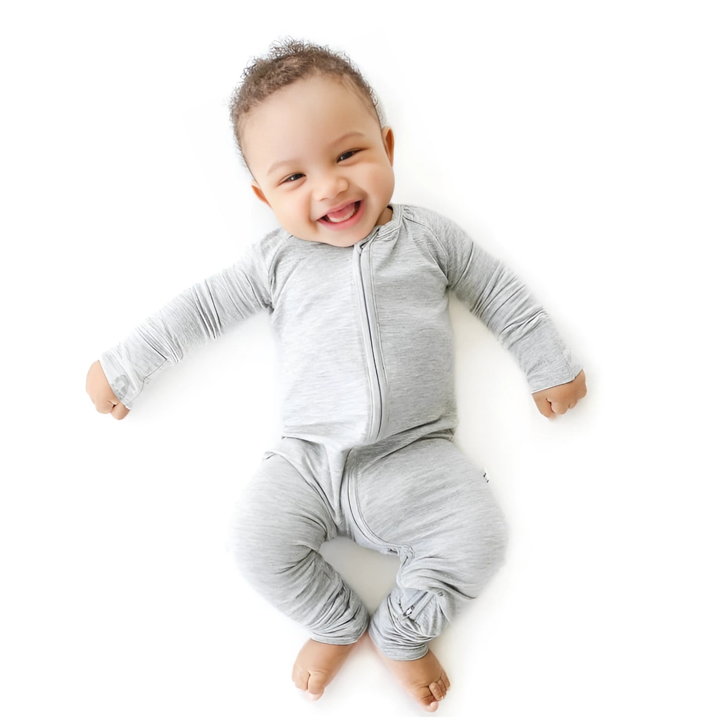 Baby laying wearing light grey bamboo pyjamas