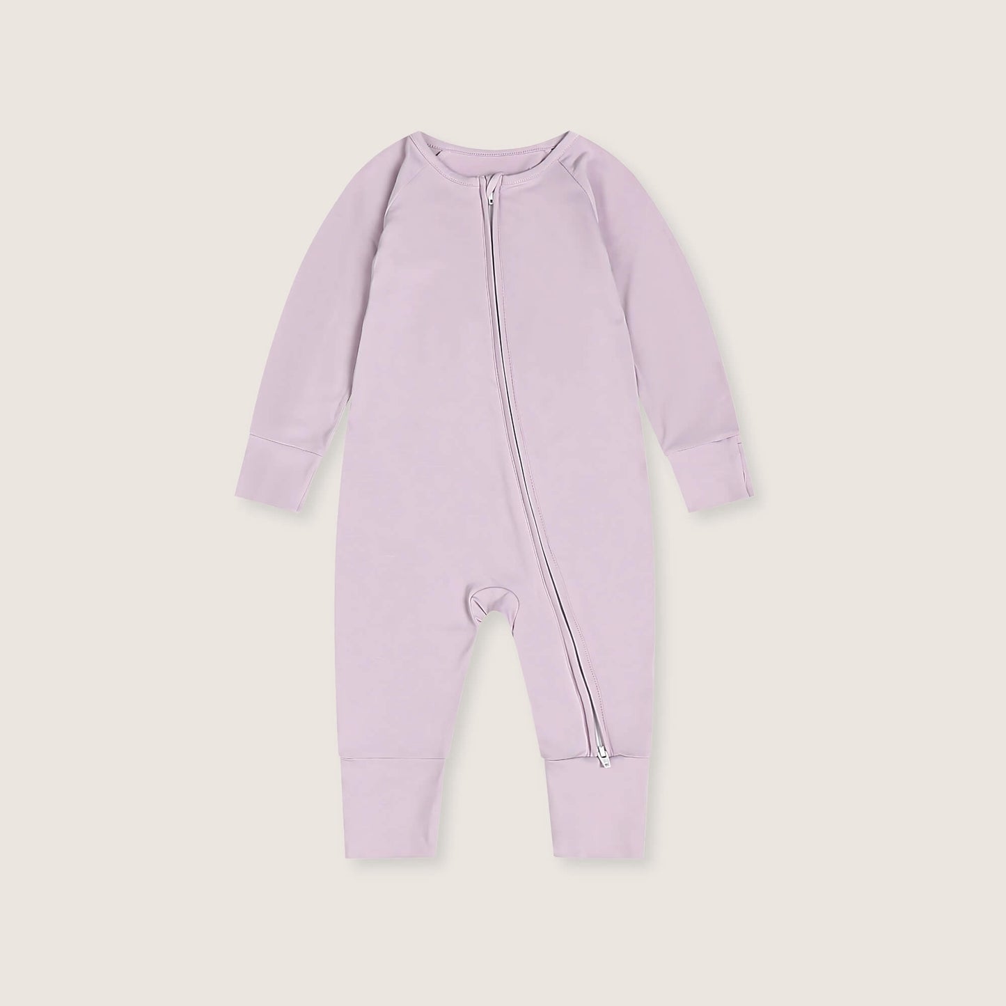 Lavender baby onesie with a zipper on a light gray background