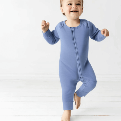 boy toddler wearing blue bamboo pyjama standing up