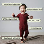 Toddler wearing a maroon bamboo baby grow standing