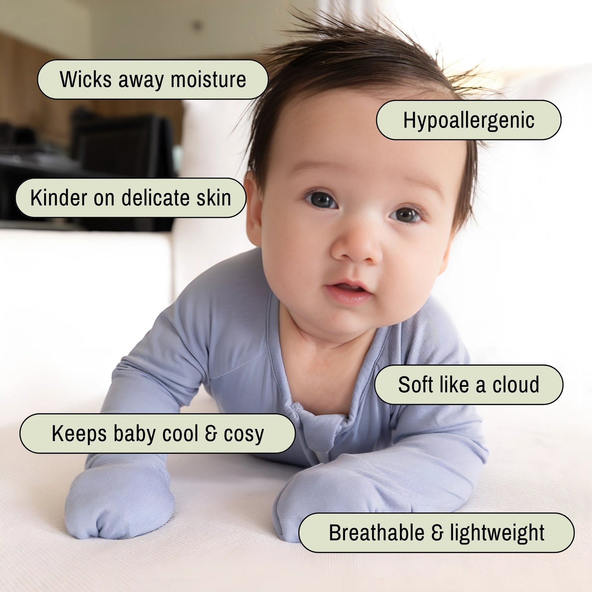 baby girl wearing blue bamboo pyjama on tummy