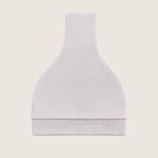 Grey baby hat with a knot on top folded against a light beige background