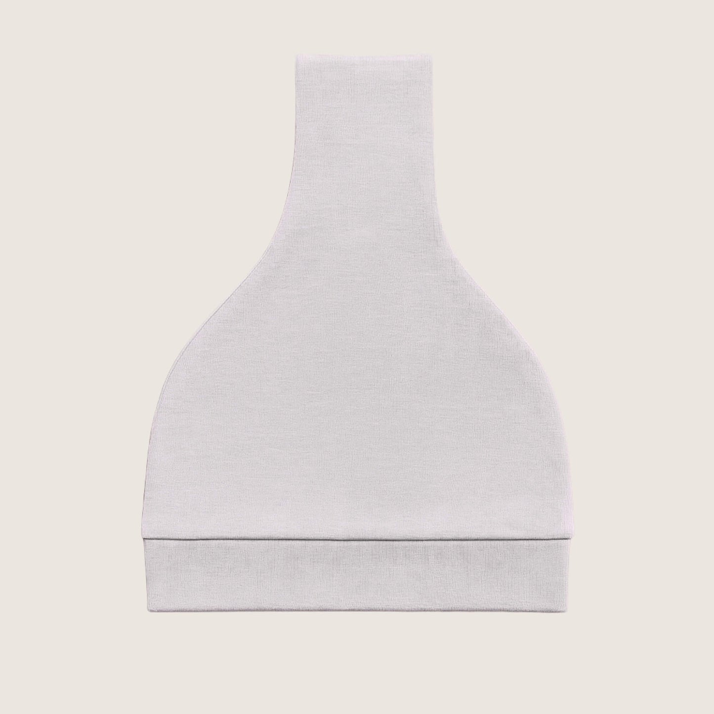 Grey baby hat with a knot on top folded against a light beige background
