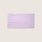 Lavender headband on a light beige background