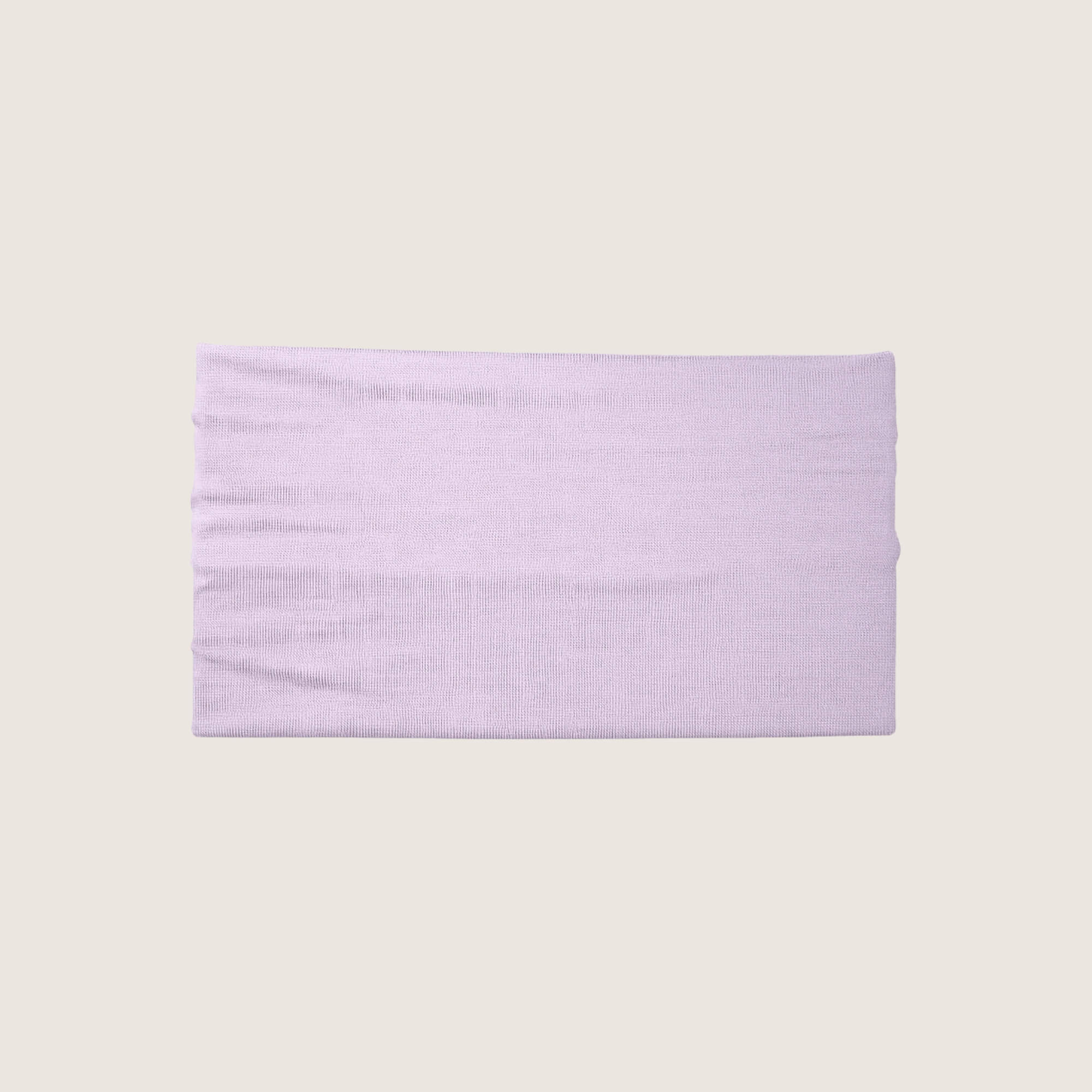 Lavender headband on a light beige background