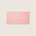 Pink fabric swatch on a beige background