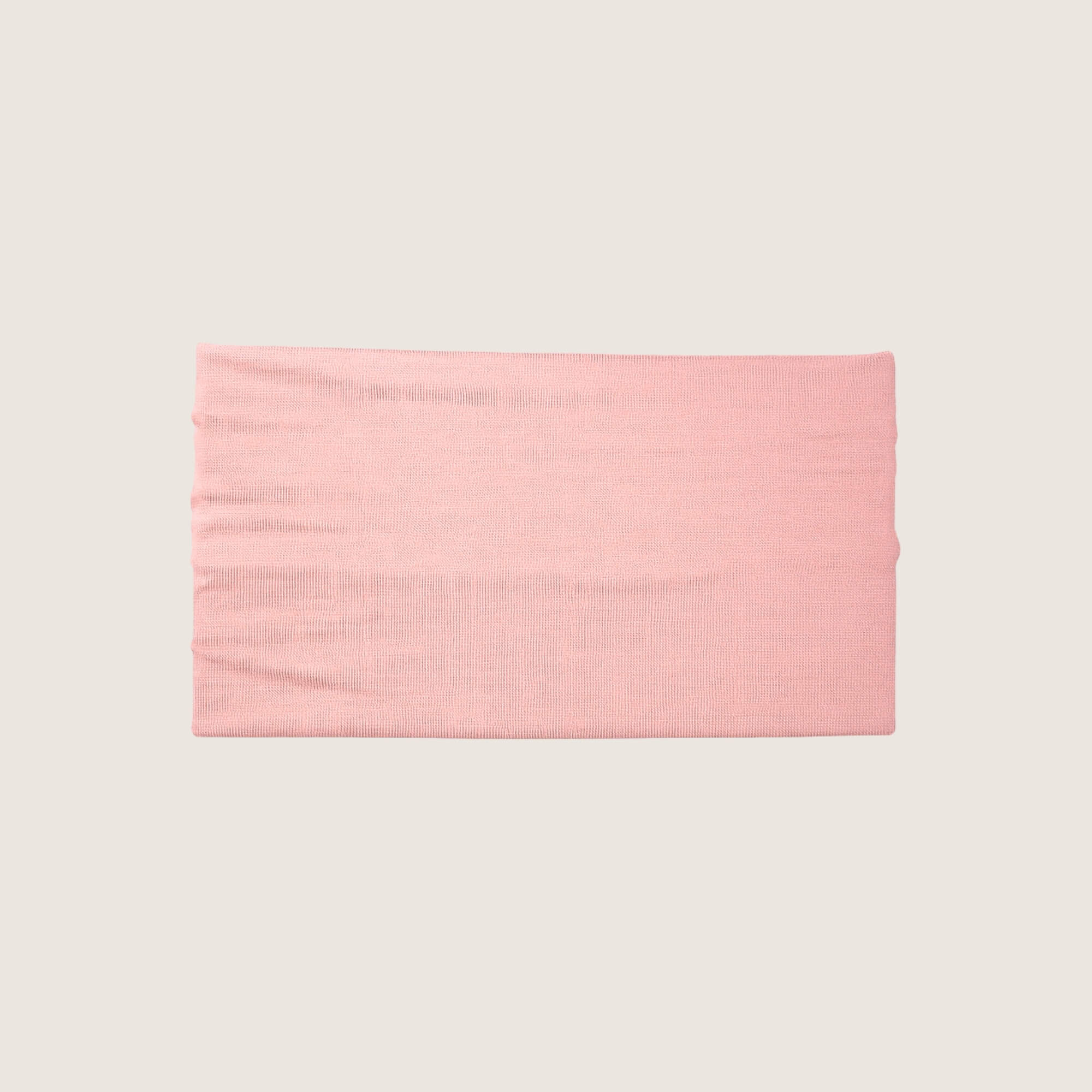Pink fabric swatch on a beige background