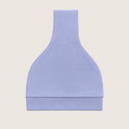 Light blue baby hat folded with a knot on top against a beige background