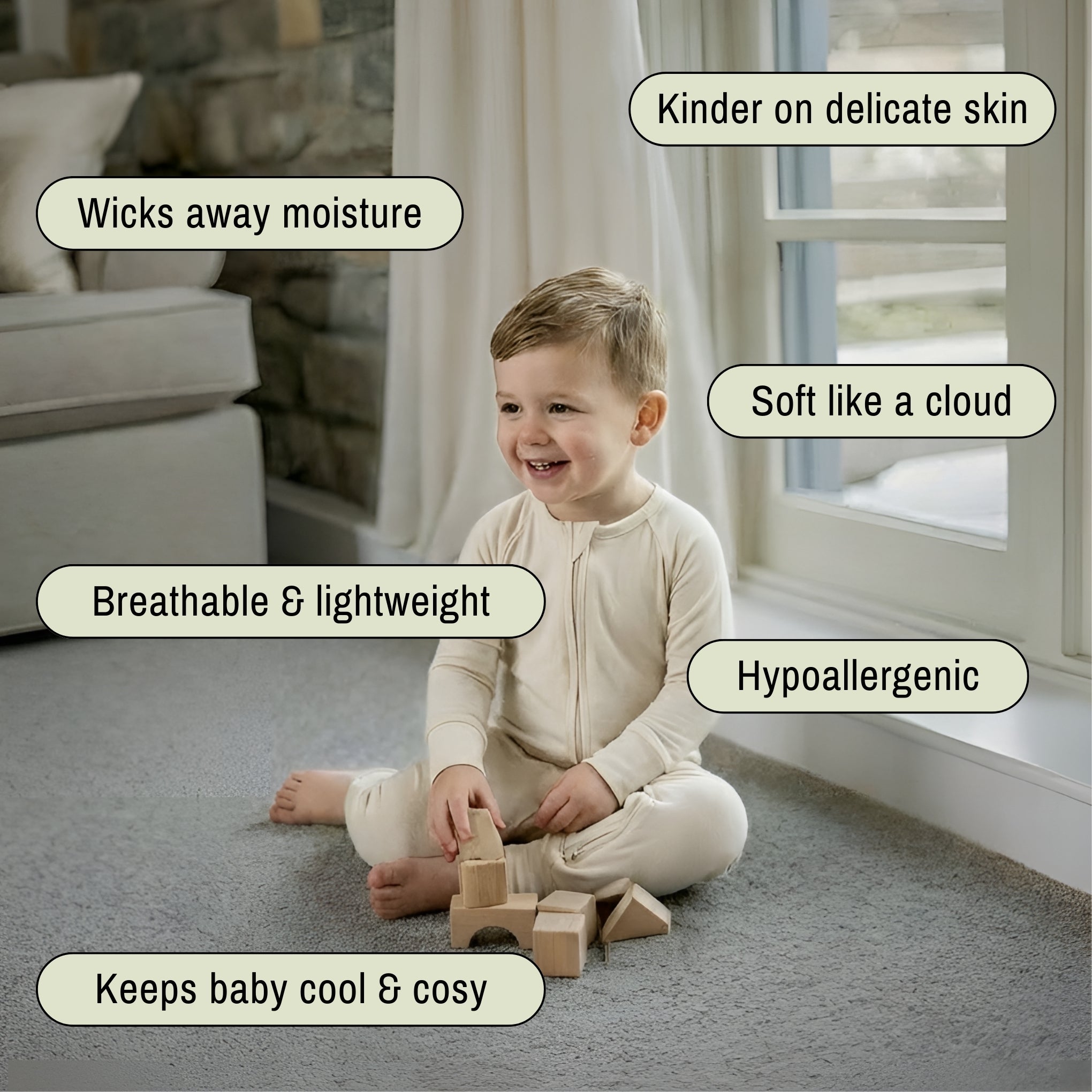 Toddler sitting wearing a light brown bamboo baby grow