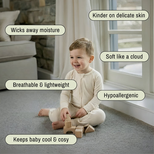 Toddler sitting wearing a light brown bamboo baby grow