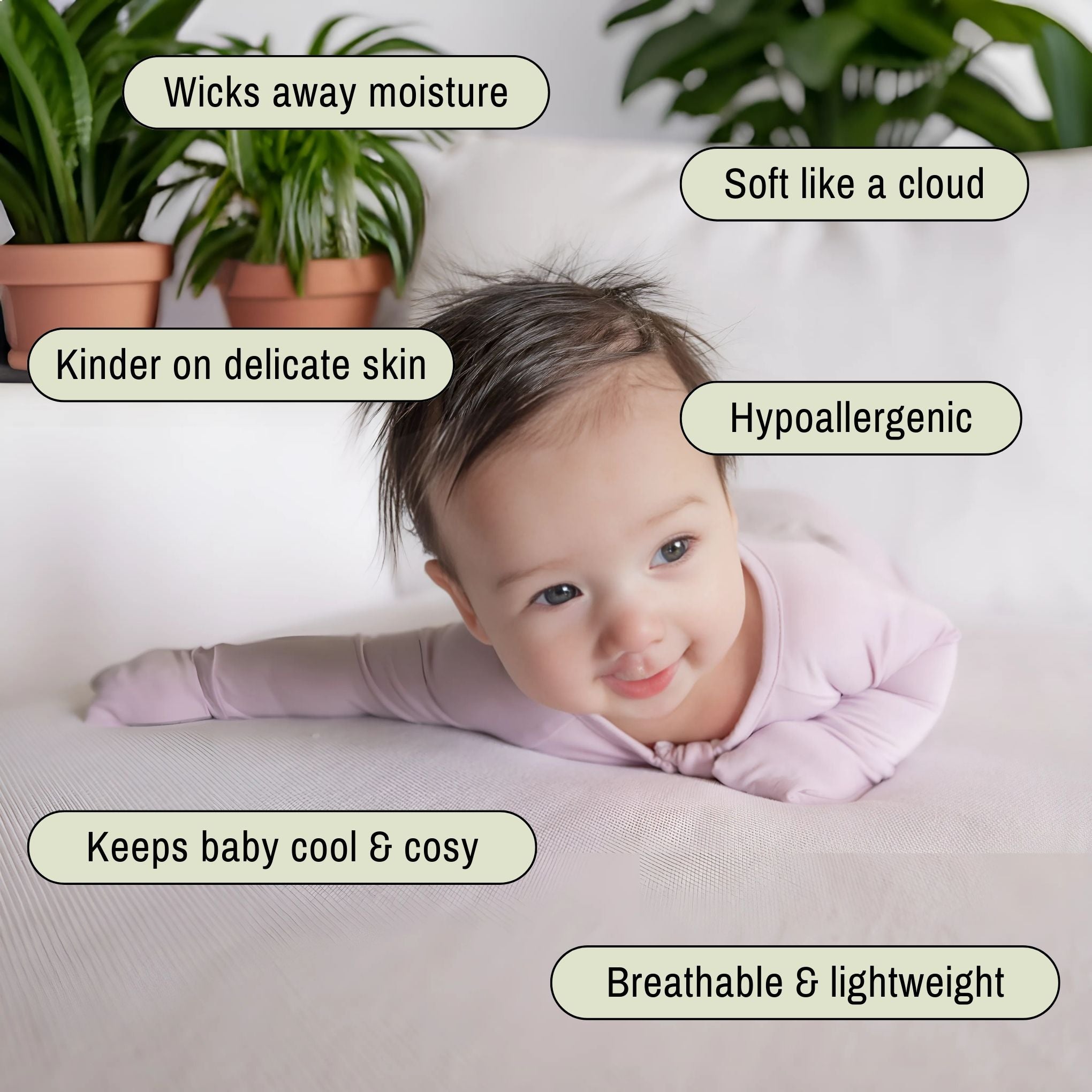 Baby wearing a lavender pyjamas laying on tummy
