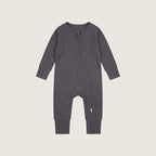Grey baby baby grow on a beige background