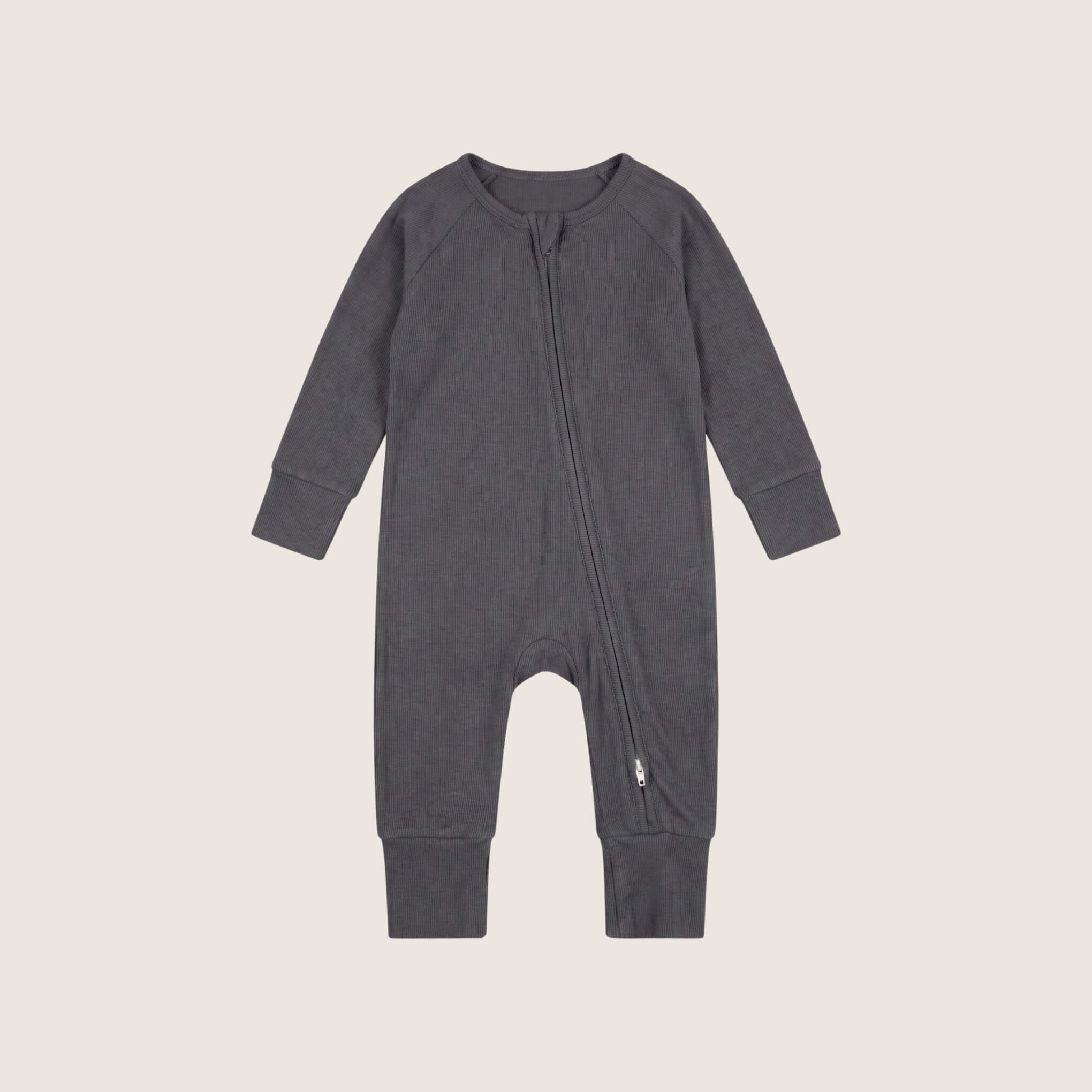Grey baby baby grow on a beige background