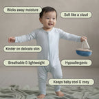 toddler baby boy wearing blue baby grow standing