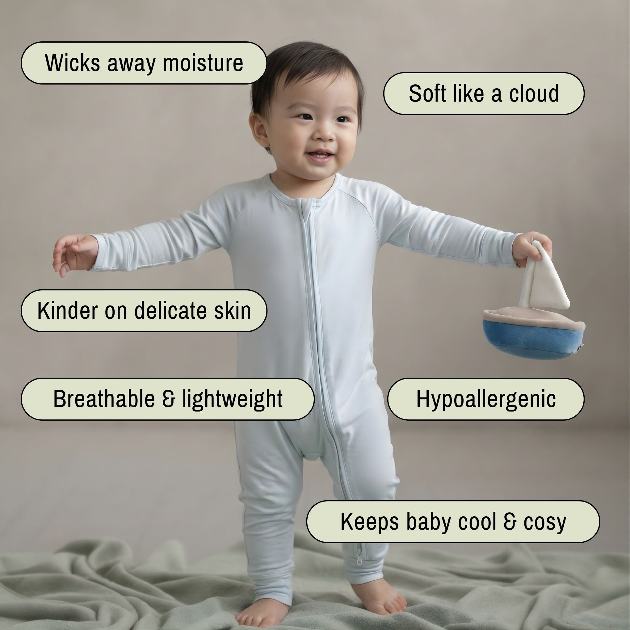 toddler baby boy wearing blue baby grow standing