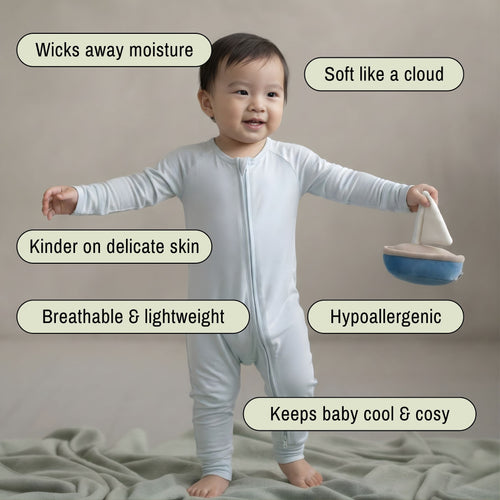 toddler baby boy wearing blue baby grow standing