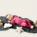 newborn girl wearing pink bamboo babygrow