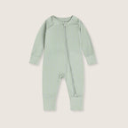 Light green baby onesie with a zipper on a light gray background