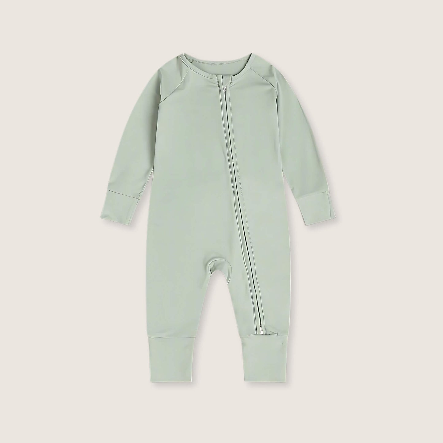 Light green baby onesie with a zipper on a light gray background