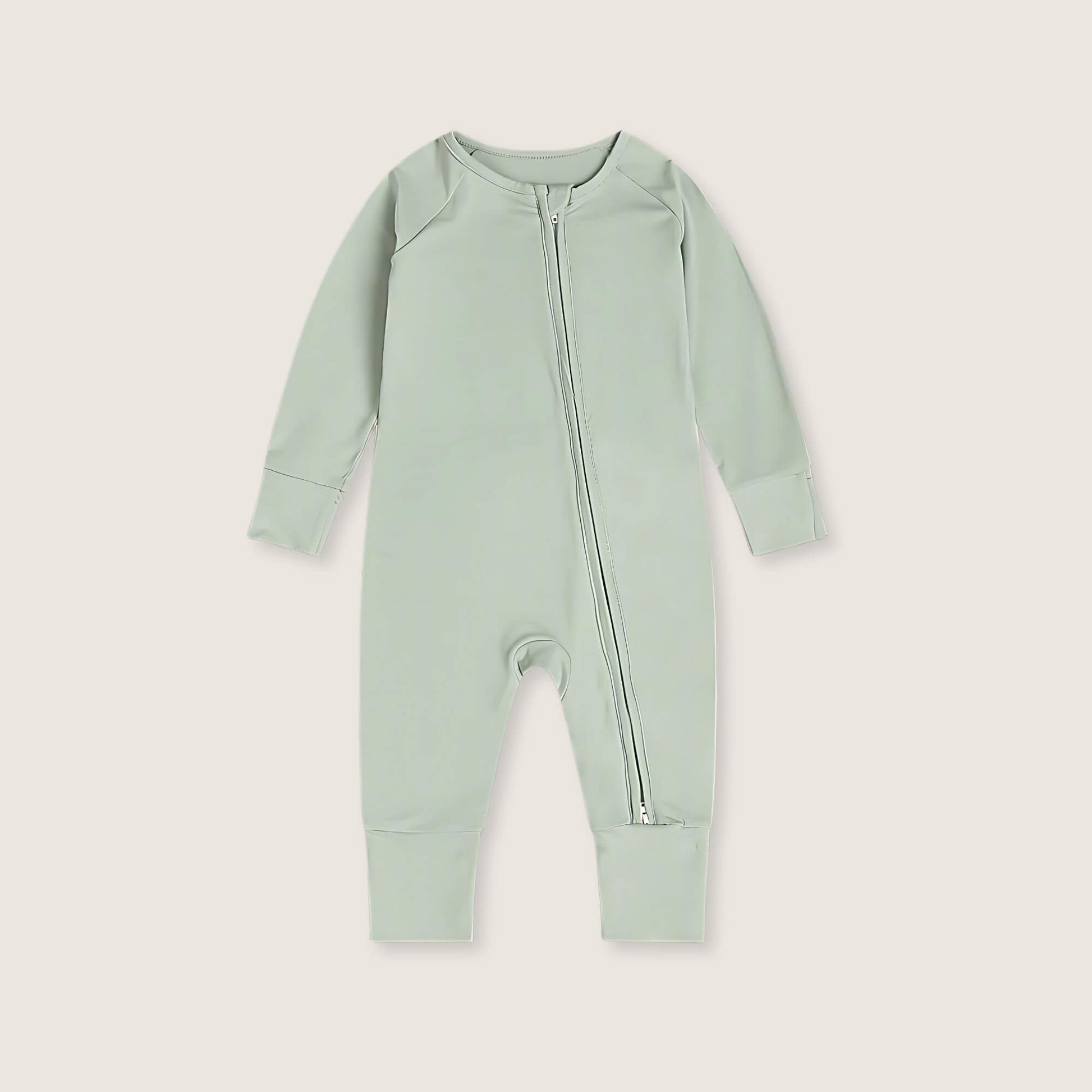 Light green baby onesie with a zipper on a light gray background