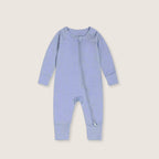 blue baby onesie on a beige background