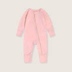 Pink baby onesie with a zipper on a light gray background